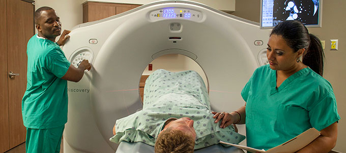Image of Radiology staff and a patient at UF Health North.